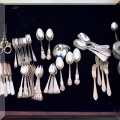 S02. Sterling silver spoons and sterling and mother-of-pearl handle knives. 